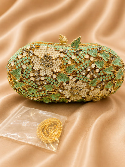 Decorative clutch bag with floral patterns on a beige fabric background
