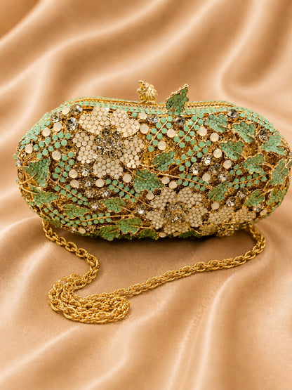 Decorative handbag with floral and leaf patterns on a beige fabric background